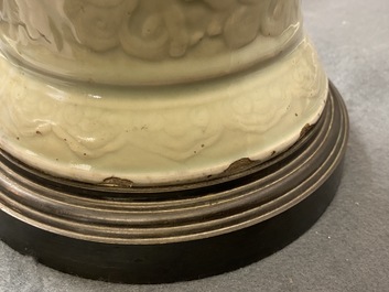 A Chinese blue and white on carved celadon-glazed ground vase, Kangxi